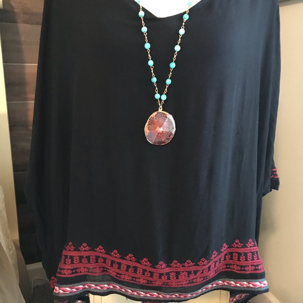 Black lined top with embroidered bottom
